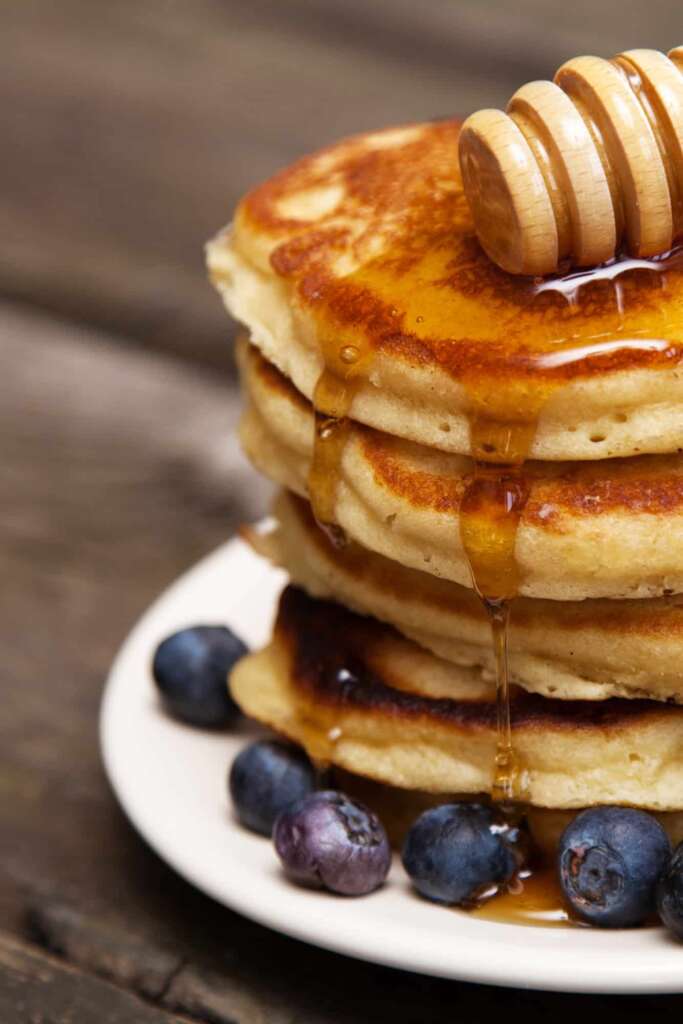 Delicious pancakes with blueberry and honey